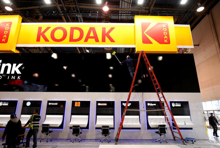 FILE PHOTO: A worker cleans a Kodak booth at the Las Vegas Convention Center in preparation for 2019 CES in Las Vegas, Nevada, U.S. January 6, 2019. REUTERS/Steve Marcus/File Photo