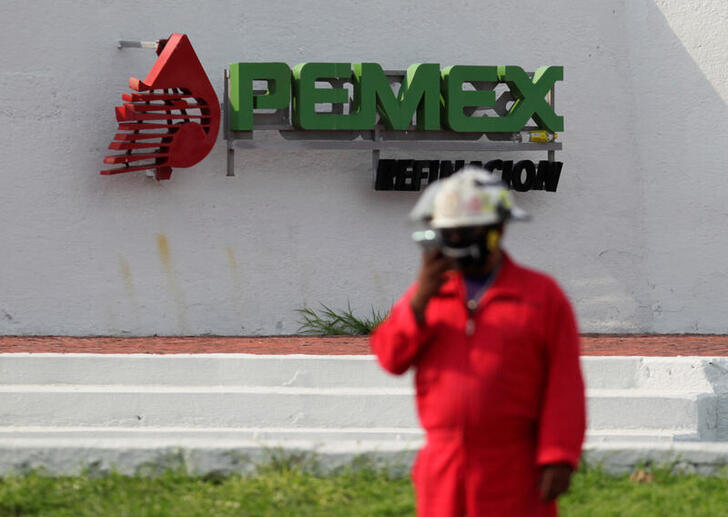 The logo of the Mexican state oil firm PEMEX is pictured during a protest against Senator Samuel Garcia's proposal to close down the Cadereyta refinery as a measure to lower the levels of pollution in the air, in Cadereyta on the outskirts of Monterrey, Mexico August 6, 2020. REUTERS/Daniel Becerril