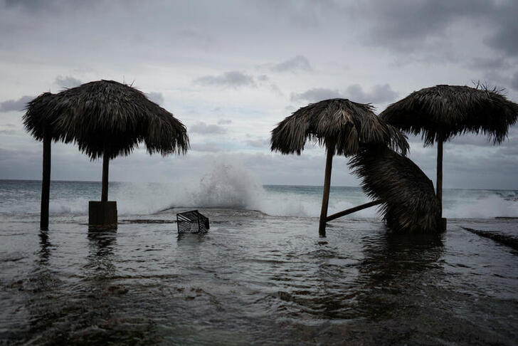 Waves splash during the passage of theTropical Storm Laura in Havana, Cuba, August 24, 2020. REUTERS/Alexandre Meneghini