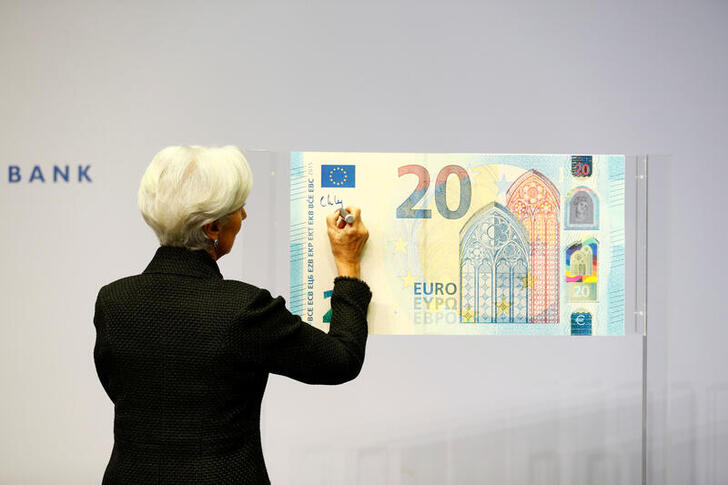 FILE PHOTO: European Central Bank (ECB) President Christine Lagarde gives a signature which will be implemented on the newly printed euro banknotes at the bank's headquarters in Frankfurt, Germany November 27, 2019. REUTERS/Ralph Orlowski/File Photo