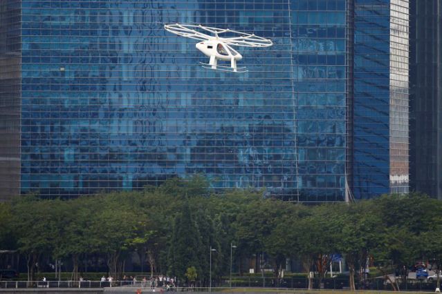 FILE PHOTO: A Volocopter air taxi performs a demonstration in Singapore, October 22, 2019. REUTERS/Feline Lim