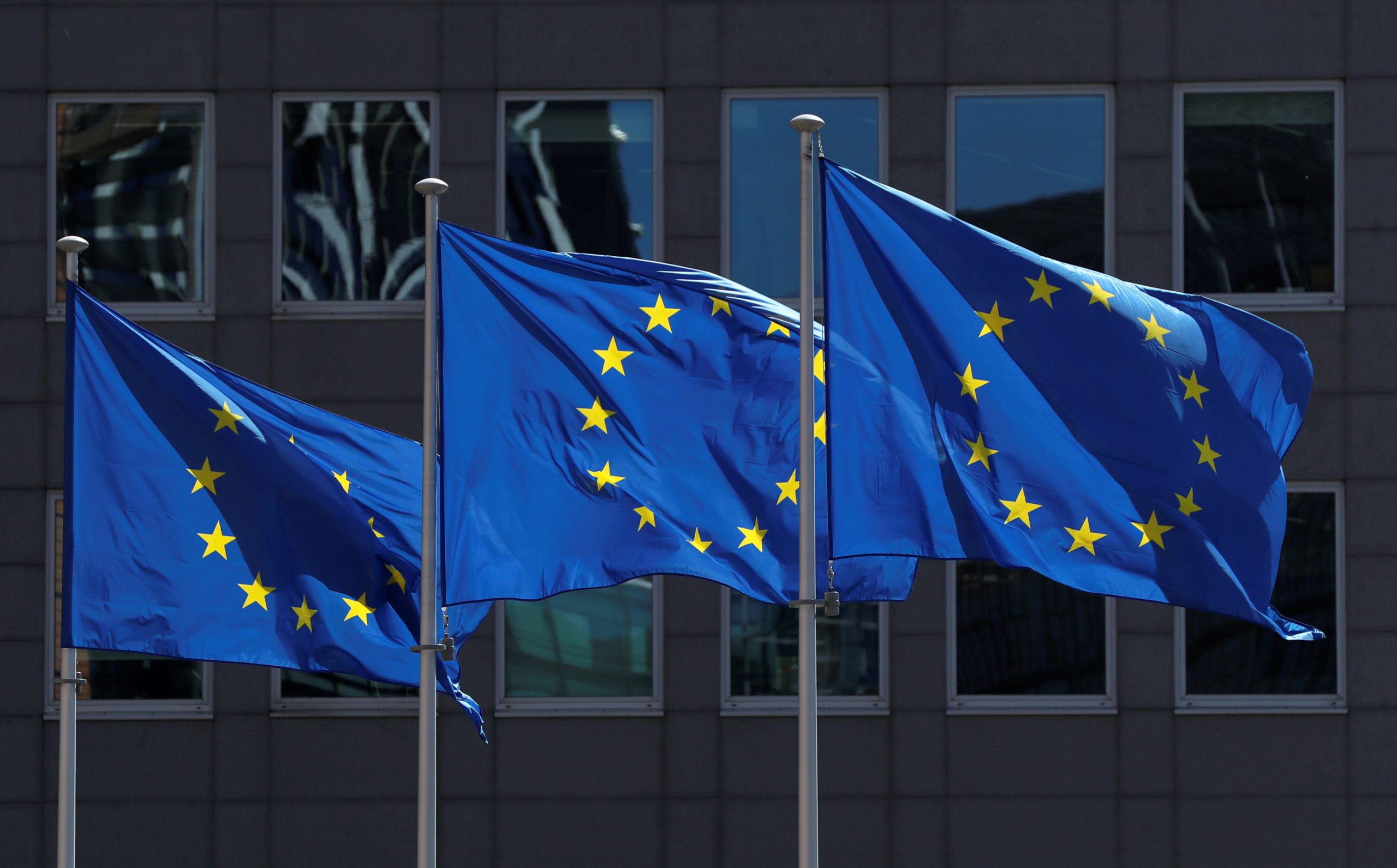 FILE PHOTO: European Union flags flutter outside the European Commission headquarters in Brussels, Belgium June 25, 2020. REUTERS/Yves Herman/File Photo - RC24TH9AHP8J