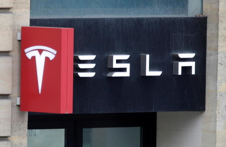 The logo of Tesla is seen on a store in Paris, France, October 30, 2020. REUTERS/Charles Platiau