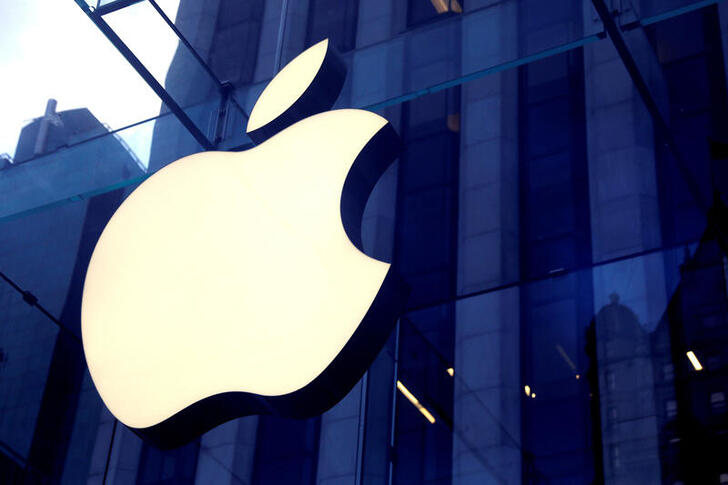 FILE PHOTO: FILE PHOTO: The Apple Inc logo is seen hanging at the entrance to the Apple store on 5th Avenue in Manhattan, New York, U.S., October 16, 2019. REUTERS/Mike Segar/File Photo/File Photo