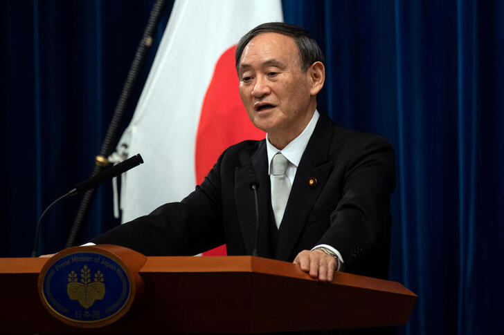 FILE PHOTO: Yoshihide Suga speaks during a news conference following his confirmation as Prime Minister of Japan in Tokyo, Japan September 16, 2020. Carl Court/Pool via REUTERS/File Photo