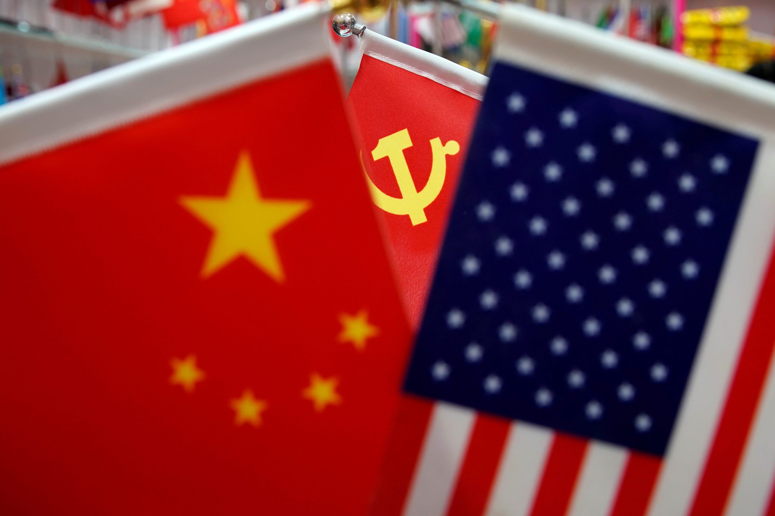 FILE PHOTO: The flags of China, U.S. and the Chinese Communist Party are displayed in a flag stall at the Yiwu Wholesale Market in Yiwu, Zhejiang province, China, May 10, 2019. REUTERS/Aly Song/File Photo - RC2R5K9ZWVNO