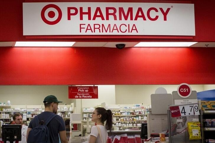 FILE PHOTO: Customers wait in the pharmacy department at a Target store in the Brooklyn borough of New York June 15, 2015. REUTERS/Brendan McDermid/File Photo