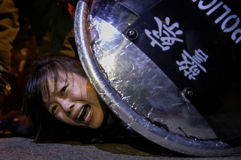 An anti-extradition bill protester is detained by riot police during skirmishes between the police and protesters outside Mong Kok police station, in Hong Kong, China September 2, 2019. Reuters has been awarded the 2020 Pulitzer Prize in Breaking News Photography for Hong Kong protests. REUTERS/Tyrone Siu