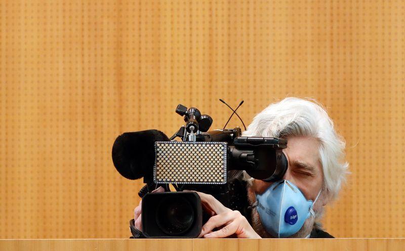 A journalist films the news conference of German Environment Minister Svenja Schulze, on the coronavirus disease (COVID-19), in Berlin, Germany, April 2, 2020. REUTERS/Fabrizio Bensch - UP1EG420NIPLP