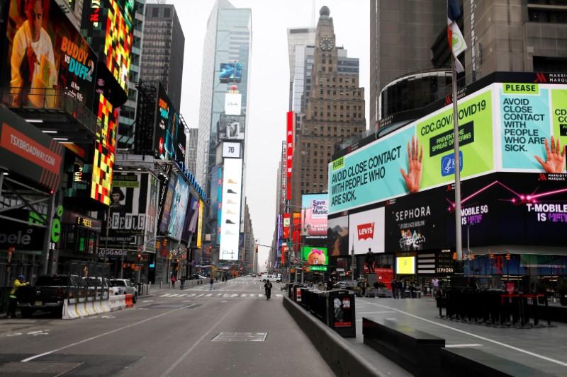 A message about protecting yourself from the coronavirus disease (COVID-19) is seen on an electronic billboard in a nearly empty Times Square in Manhattan in New York City, New York, U.S., March 20, 2020. REUTERS/Mike Segar - RC2RNF911440
