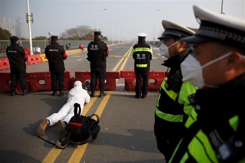 Martin Pollard covering a police checkpoint on the outskirts of Hubei province
