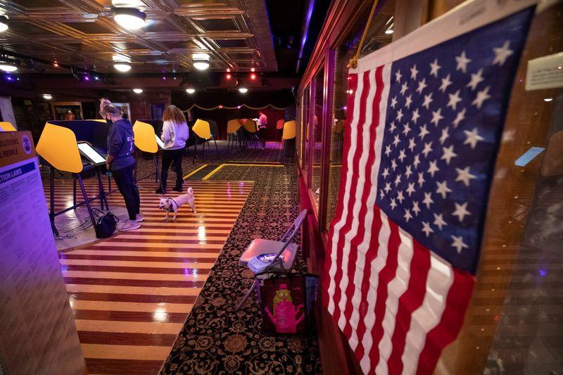 People vote during the U.S. presidential election at The Magic Castle Club during the outbreak of the coronavirus disease (COVID-19), in Los Angeles, California, U.S., November 2, 2020. REUTERS/Mario Anzuoni 