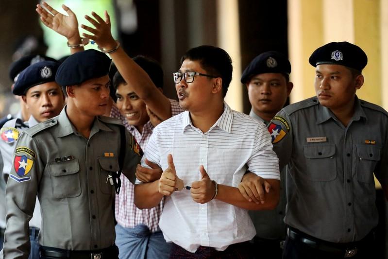 FILE PHOTO: Detained Reuters journalists Wa Lone and Kyaw Soe Oo arrive at Insein court in Yangon, Myanmar, Aug. 27, 2018. REUTERS/Ann Wang/