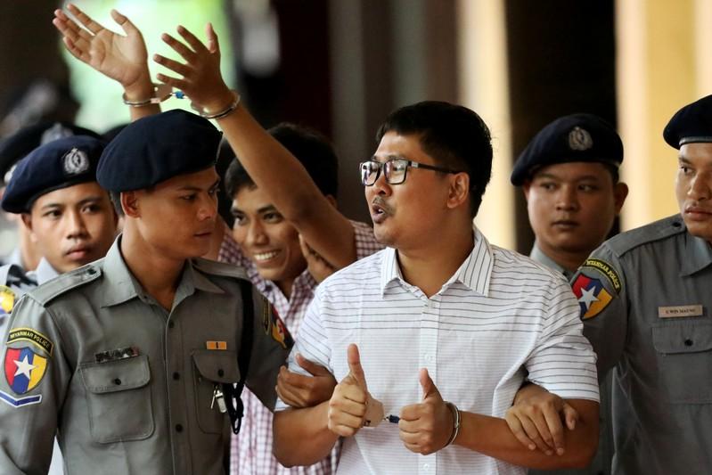 Detained Reuters journalists Wa Lone and Kyaw Soe Oo arrive at Insein court in Yangon, Myanmar August 27, 2018. REUTERS/Ann Wang