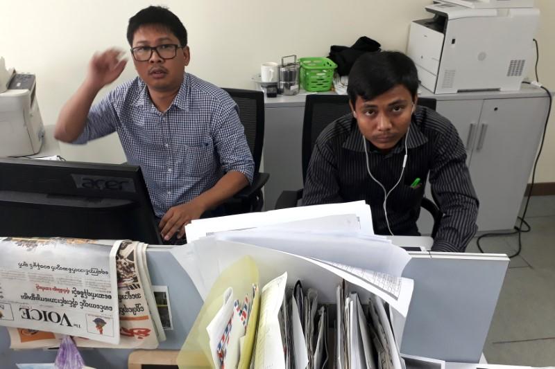 Reuters journalists Wa Lone (L) and Kyaw Soe Oo, who are based in Myanmar, pose for a picture at the Reuters office in Yangon, Myanmar December 11, 2017. Picture taken December 11, 2017. REUTERS/Antoni Slodkowski - RC1C7E5B9920