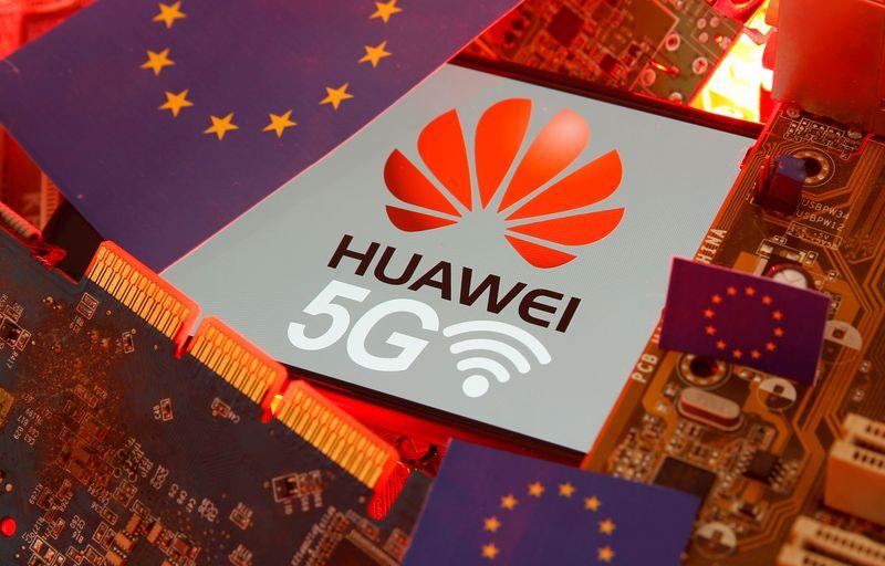 The EU flag and a smartphone with the Huawei and 5G network logo are seen on a PC motherboard in this illustration taken January 29, 2020. REUTERS/Dado Ruvic/Illustration