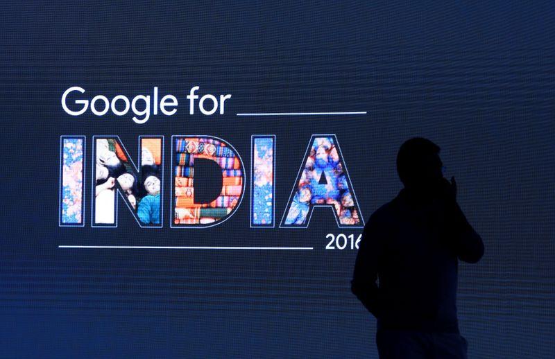 FILE PHOTO: A man stands in front of a screen during a Google event in New Delhi, India September 27, 2016. REUTERS/Adnan Abidi/File Photo