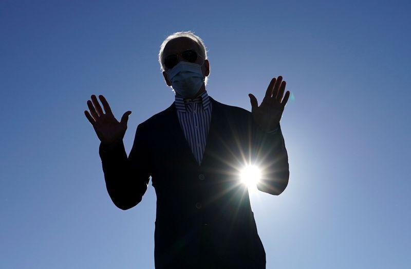 U.S. Democratic presidential candidate Joe Biden speaks to reporters as he departs Wilmington, Delaware, U.S., October 8, 2020. REUTERS/Kevin Lamarque