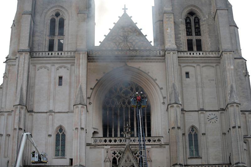 French firefighters battle a blaze at the Cathedral of Saint Pierre and Saint Paul in Nantes, France, July 18, 2020. REUTERS/Stephane Mahe