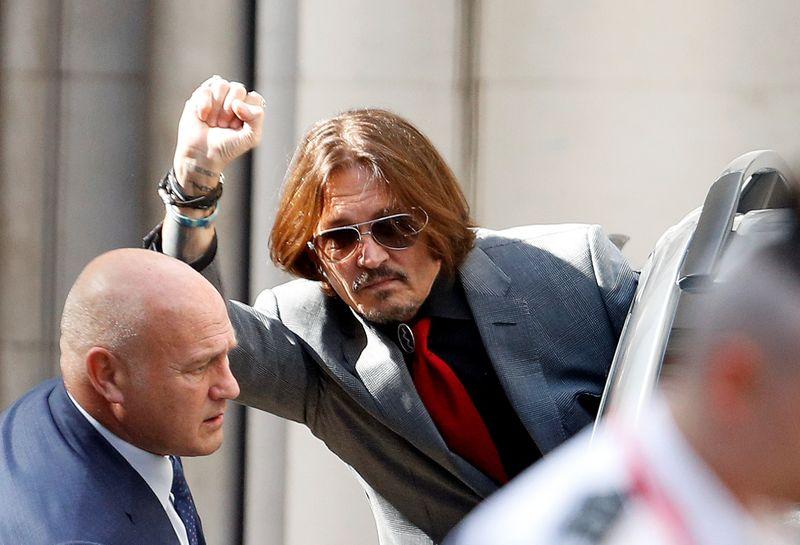 Actor Johnny Depp gestures as he leaves the High Court in London, Britain July 21, 2020. REUTERS/Peter Nicholls