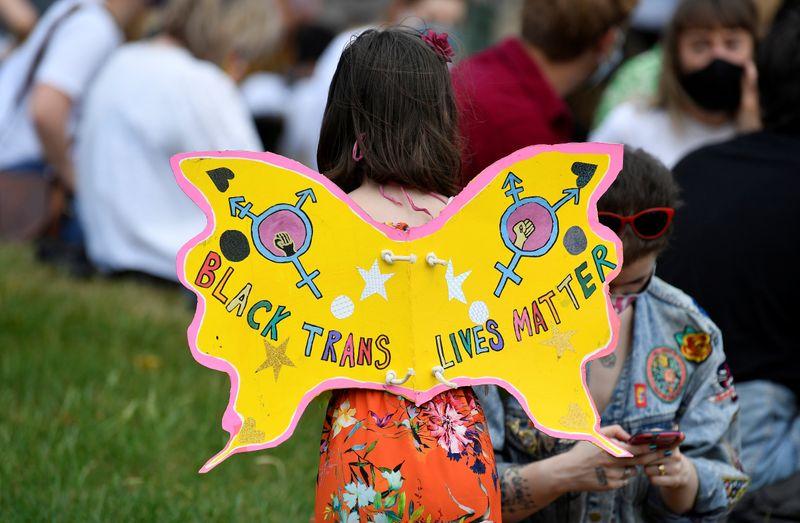 A participant wears cardboard wings during a Black Trans Lives Matter rally in London, Britain, June 27, 2020. REUTERS/Toby Melville