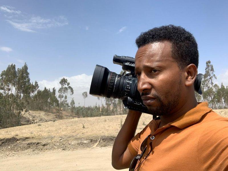 A photograph taken from the family album shows Reuters cameraman Kumerra Gemechu as he arrives to cover a breaking news assignment in Bishoftu, Ethiopia March 10, 2019. Picture taken March 10, 2019. Family Album/Handout via REUTERS.