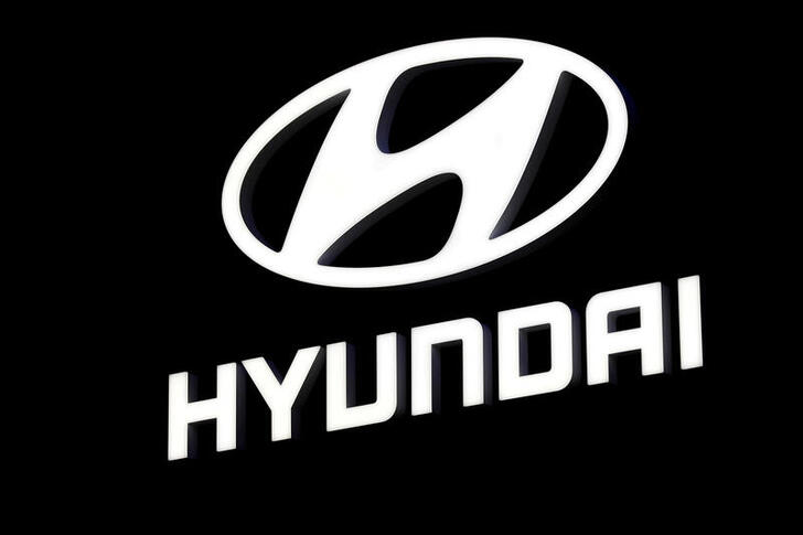 FILE PHOTO: The Hyundai booth displays the company logo at the North American International Auto Show in Detroit, Michigan, U.S. January 16, 2018.  REUTERS/Jonathan Ernst/File Photo/File Photo