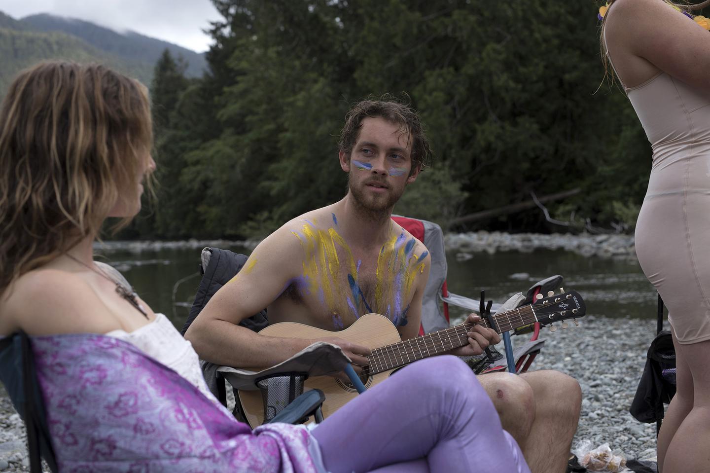 Ian O'Brien plays the guitar while camping along the Pacific Rim Highway on Vancouver Island, on July 04, 2020. Credit: Melissa Renwick.