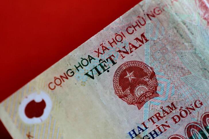 FILE PHOTO: A Vietnam Dong note is seen in this illustration photo May 31, 2017.     REUTERS/Thomas White/Illustration/File Photo