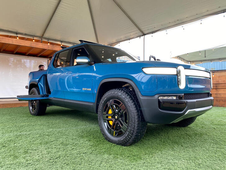 FILE PHOTO: The Rivian R1T all-electric truck is pictured at an event, held by the electric vehicle startup, for customers who preordered the truck, in Mill Valley, California, U.S., January 25, 2020. REUTERS/Nathan Frandino/File Photo