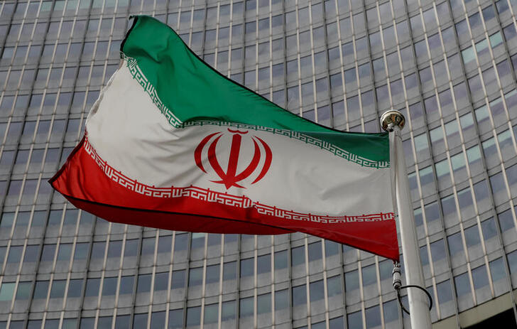 FILE PHOTO: An Iranian flag flutters in front of the International Atomic Energy Agency (IAEA) headquarters in Vienna, Austria, September 9, 2019.   REUTERS/Leonhard Foeger/File Photo