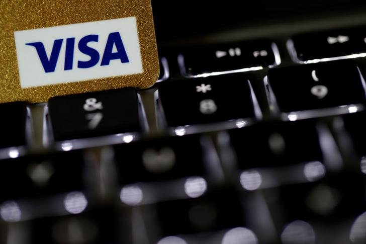 A Visa credit card is seen on a computer keyboard in this picture illustration taken September 6, 2017. REUTERS/Philippe Wojazer/Illustration