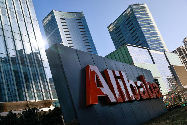 FILE PHOTO: FILE PHOTO: The logo of Alibaba Group is seen at its office in Beijing, China January 5, 2021. REUTERS/Thomas Peter/File Photo/File Photo