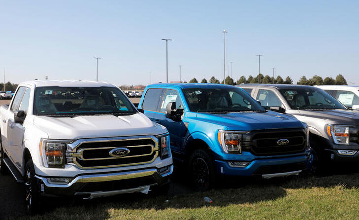 Newly manufactured Ford Motor Co. 2021 F-150 pick-up trucks are seen waiting for missing parts in Dearborn, Michigan, U.S., March 29, 2021. Picture taken March 29, 2021.  REUTERS/Rebecca Cook