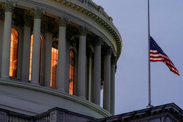 The flag flies at half staff at U.S. Capitol as Democratic lawmakers draw up an article of impeachment against U.S. President Donald Trump in Washington, U.S., January 11, 2021.      REUTERS/Joshua Roberts     TPX IMAGES OF THE DAY
