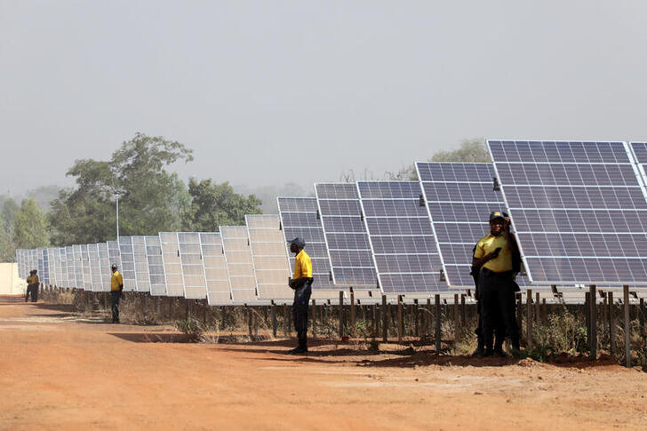 FILE PHOTO: Solar panels are seen during the inauguration ceremony of the solar energy power plant in Zaktubi, near Ouagadougou, Burkina Faso, November 29, 2017. REUTERS/Ludovic Marin/Pool/File Photo