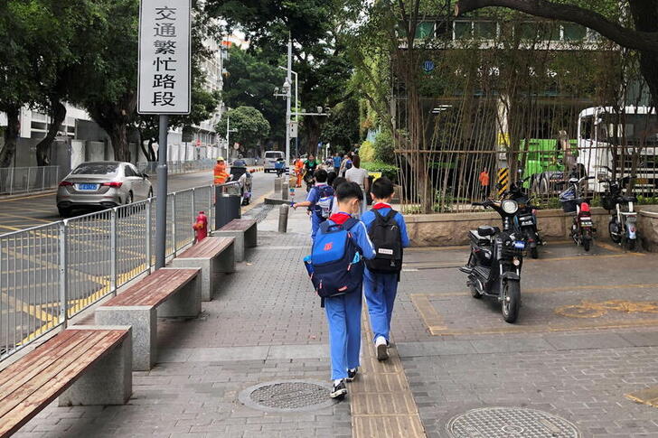 FILE PHOTO: Children leave a school in Shekou area of Shenzhen, Guangdong province, China April 20, 2021. REUTERS/David Kirton/File Photo