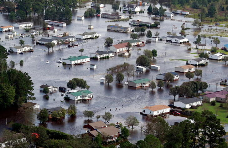 FILE PHOTO: Houses sit in floodwater caused by Hurricane Florence, in this aerial picture, on the outskirts of Lumberton, North Carolina, U.S. September 17, 2018. REUTERS/Jason Miczek/File Photo
