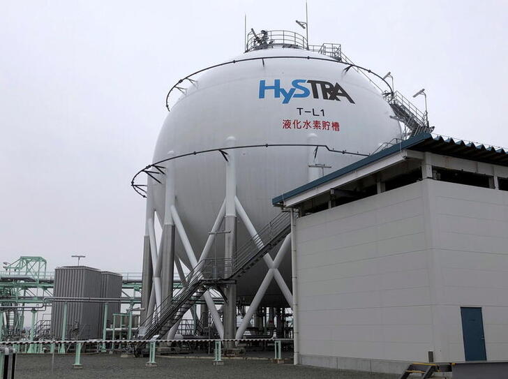 FILE PHOTO: The logo of the CO2-free Hydrogen Energy Supply-chain Technology Research Association (HySTRA) is seen on a liquefied hydrogen storage tank built by Kawasaki Heavy Industries at the hydrogen receiving terminal at the Kobe Airport Island in Kobe, western Japan January 22, 2021. Picture taken January 22, 2021.  REUTERS/Yuka Obayashi/File Photo