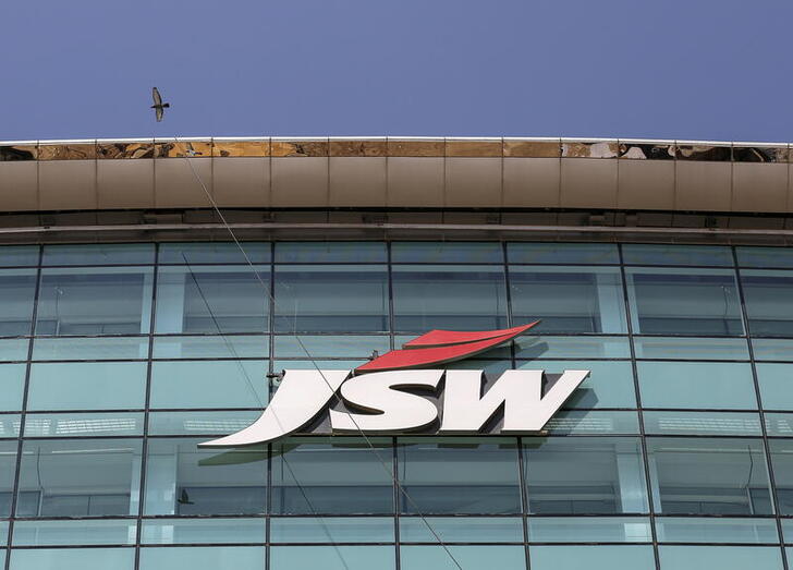 FILE PHOTO: The logo of JSW is seen on the company's headquarters in Mumbai, India, February 11, 2016. Indian conglomerate JSW Group, whose businesses range from power to steel and cement, is looking to buy debt-laden port assets in the country as part of a strategy for a massive expansion of its ports capacity, its chief financial officer said. Picture taken February 11, 2016.  REUTERS/Danish Siddiqui/File Photo