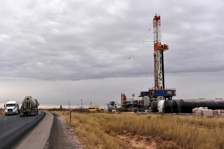 FILE PHOTO: A drilling rig operates in the Permian Basin oil and natural gas production area in Lea County, New Mexico, U.S., February 10, 2019.   REUTERS/Nick Oxford//File Photo/File Photo