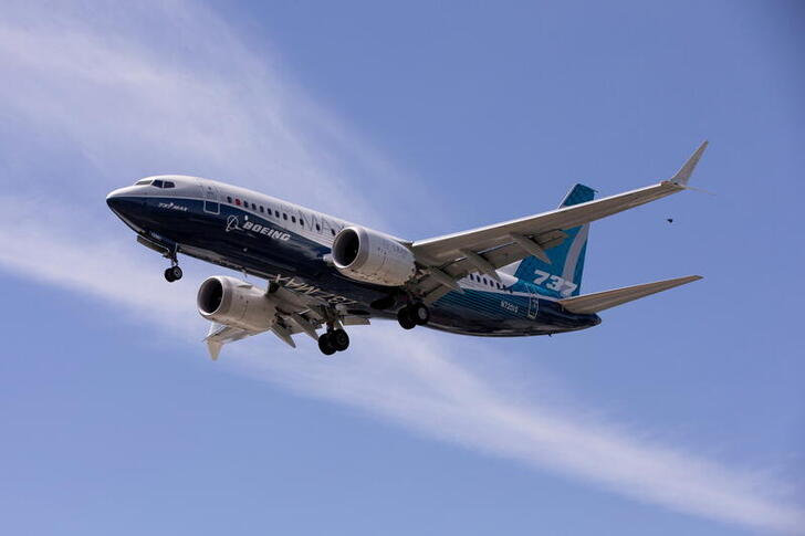 FILE PHOTO: A Boeing 737 MAX airplane lands after a test flight at Boeing Field in Seattle, Washington, U.S. June 29, 2020. REUTERS/Karen Ducey/File Photo/File Photo