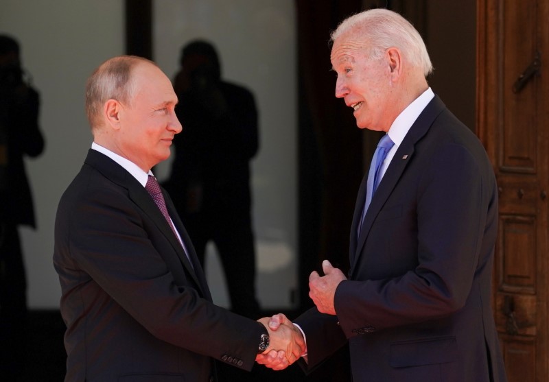 U.S. President Joe Biden and Russia's President Vladimir Putin shake hands as they arrive for the U.S.-Russia summit at Villa La Grange in Geneva, Switzerland, June 16, 2021. REUTERS/Kevin Lamarque