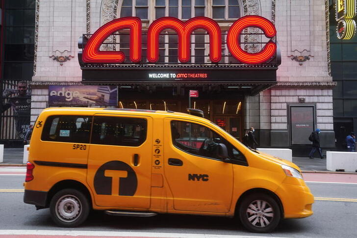 A taxi passes an AMC theatre amid the coronavirus disease (COVID-19) pandemic in the Manhattan borough of New York City, New York, U.S., January 27, 2021. REUTERS/Carlo Allegri