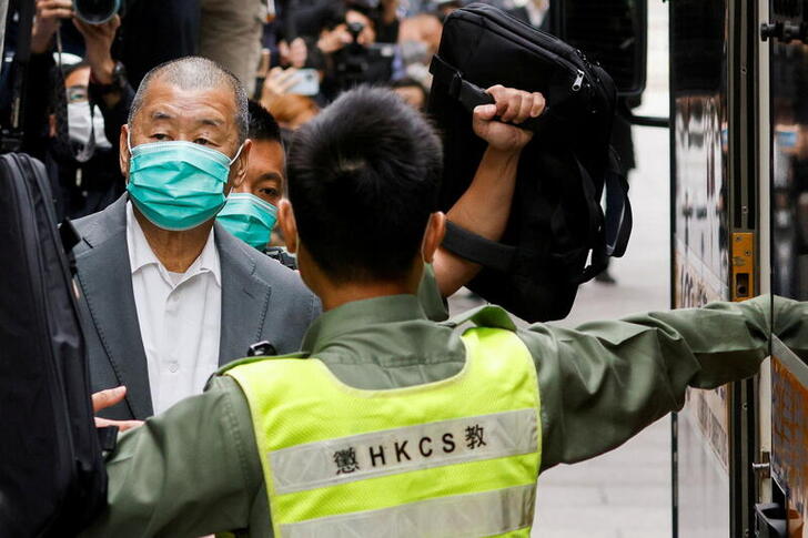 FILE PHOTO: Media mogul Jimmy Lai, founder of Apple Daily, leaves the Court of Final Appeal by prison van in Hong Kong, China February 9, 2021. REUTERS/Tyrone Siu/File Photo