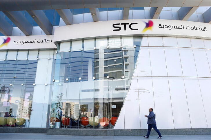 FILE PHOTO: A man passes the Saudi Telecom STC office in Riyadh, Saudi Arabia, February 6, 2018. REUTERS/Faisal Al Nasser/File Photo