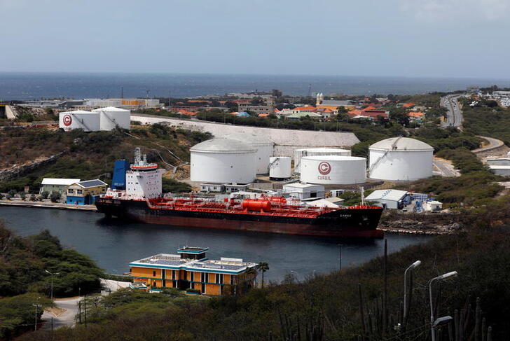 FILE PHOTO: A crude oil tanker is docked at Isla Oil Refinery PDVSA terminal in Willemstad on the island of Curacao, February 22, 2019. REUTERS/Henry Romero/File Photo