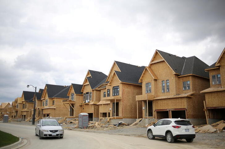 FILE PHOTO: A row of houses under construction is seen at a subdivision near the town of Kleinburg, Ontario, Canada May 13, 2017.  REUTERS/Chris Helgren/File Photo