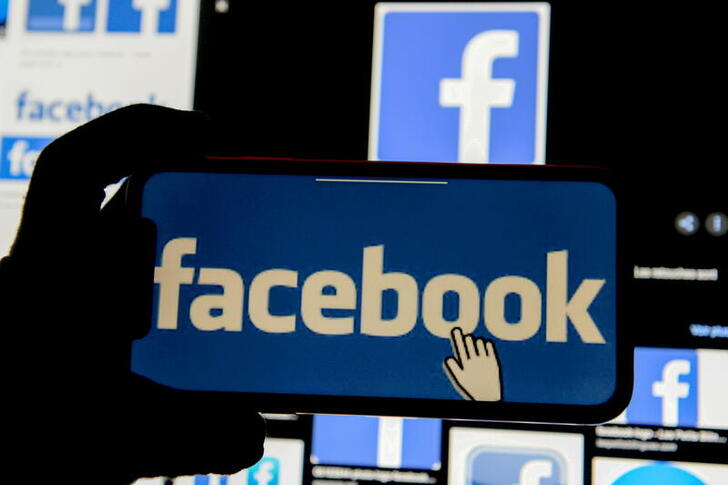 FILE PHOTO: The Facebook logo is displayed on a mobile phone in this picture illustration taken December 2, 2019. REUTERS/Johanna Geron/Illustration/File Photo