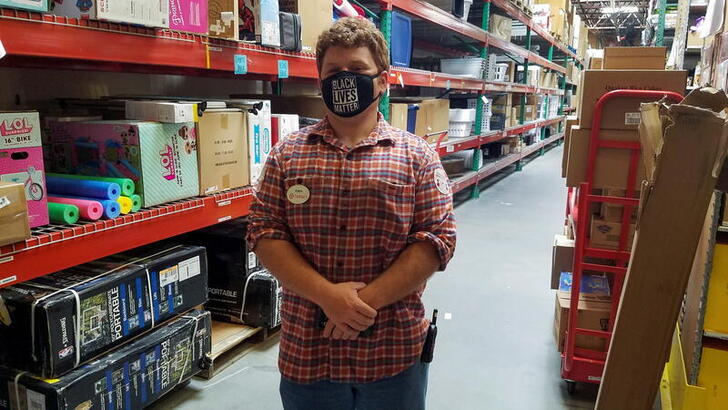 Target worker Adam Ryan stands in the stockroom of his store in Christiansburg, Virginia, U.S. May 10, 2021. Picture taken May 10, 2021. Adam Ryan/Handout via REUTERS   THIS IMAGE HAS BEEN SUPPLIED BY A THIRD PARTY.